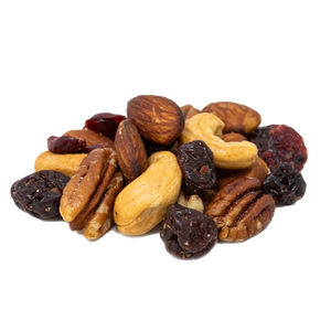 pile of raw cashews, almonds, and pecans with dried michigan cherries and cranberries